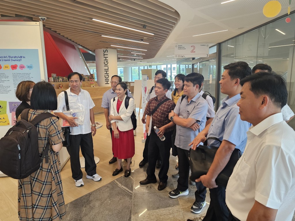 Participants visiting the library in Our Tampines Hub to understand how the National Library Board transforms libraries for citizens in the face of digitalisation